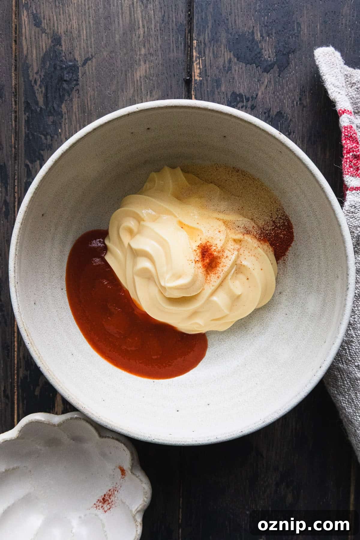 Making the sriracha cream sauce.