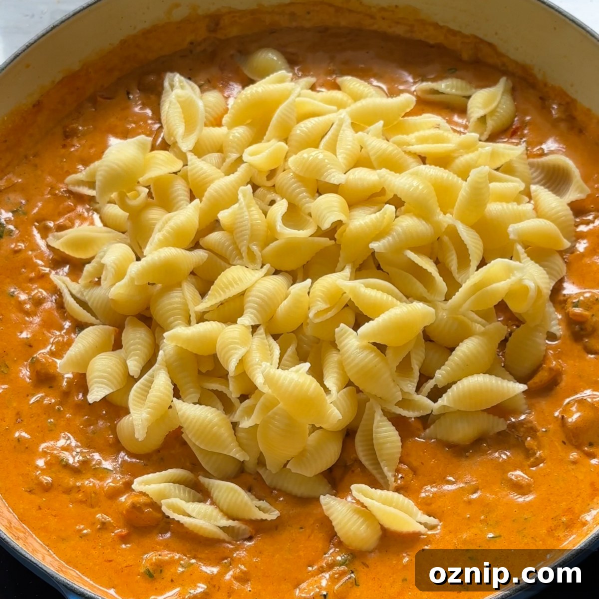 Marry Me Chicken Pasta: Creamy Tomato Parmesan Recipe 6 Adding pasta