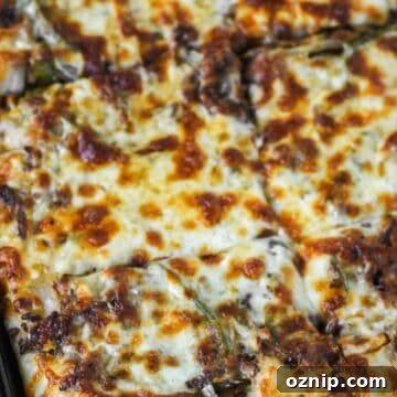 Philly cheesesteak pizza in pan.