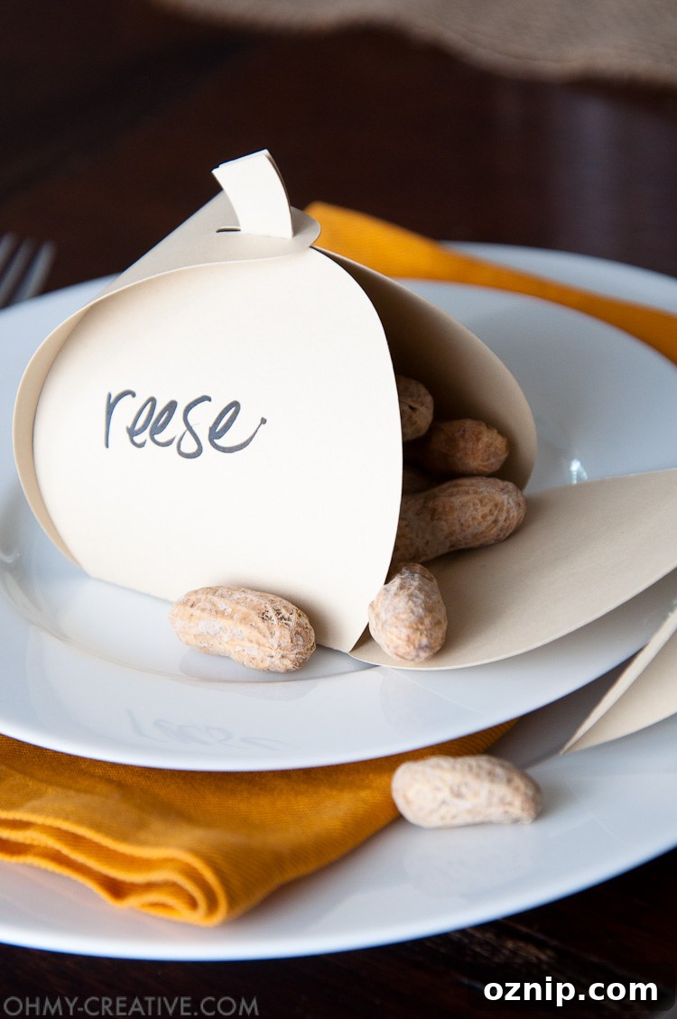 Make these easy paper pumpkins for your Thanksgiving table or any DIY Thanksgiving decorations. You can fill them with treats, use them as a place card, or just put them on your mantle to decorate. | OHMY-CREATIVE.COM