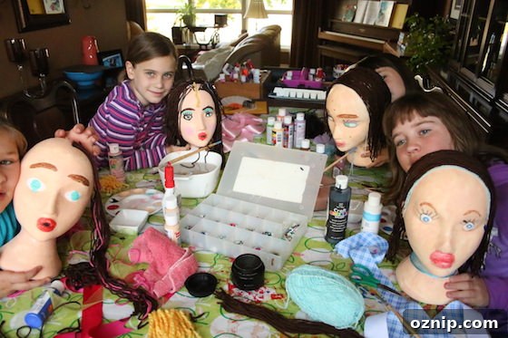 Styrofoam Head Self Portrait Art Project for Kids 11 kids posing with styrofoam head self-portraits