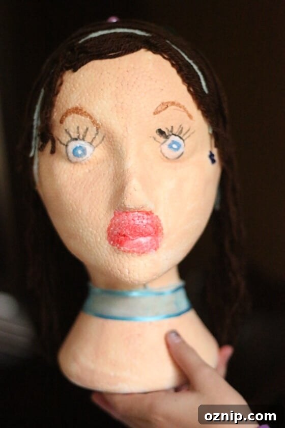 Styrofoam Head Self Portrait Art Project for Kids 15 Styrofoam mannequin head decorated by child