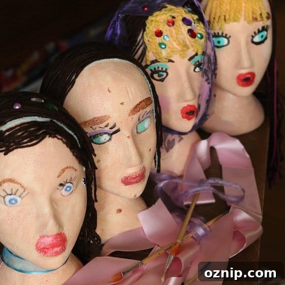Styrofoam Head Self Portrait Art Project for Kids 16 white styrofoam head self-portraits painted and decorated by kids