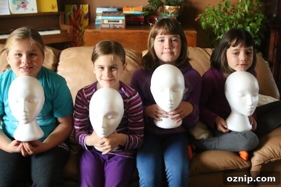 Styrofoam Head Self Portrait Art Project for Kids 5 4 kids holding white styrofoam mannequin heads