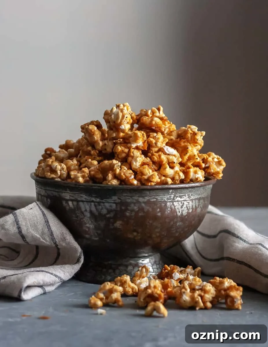 Bowl of crunchy chai tea caramel corn for a sweet fall snack