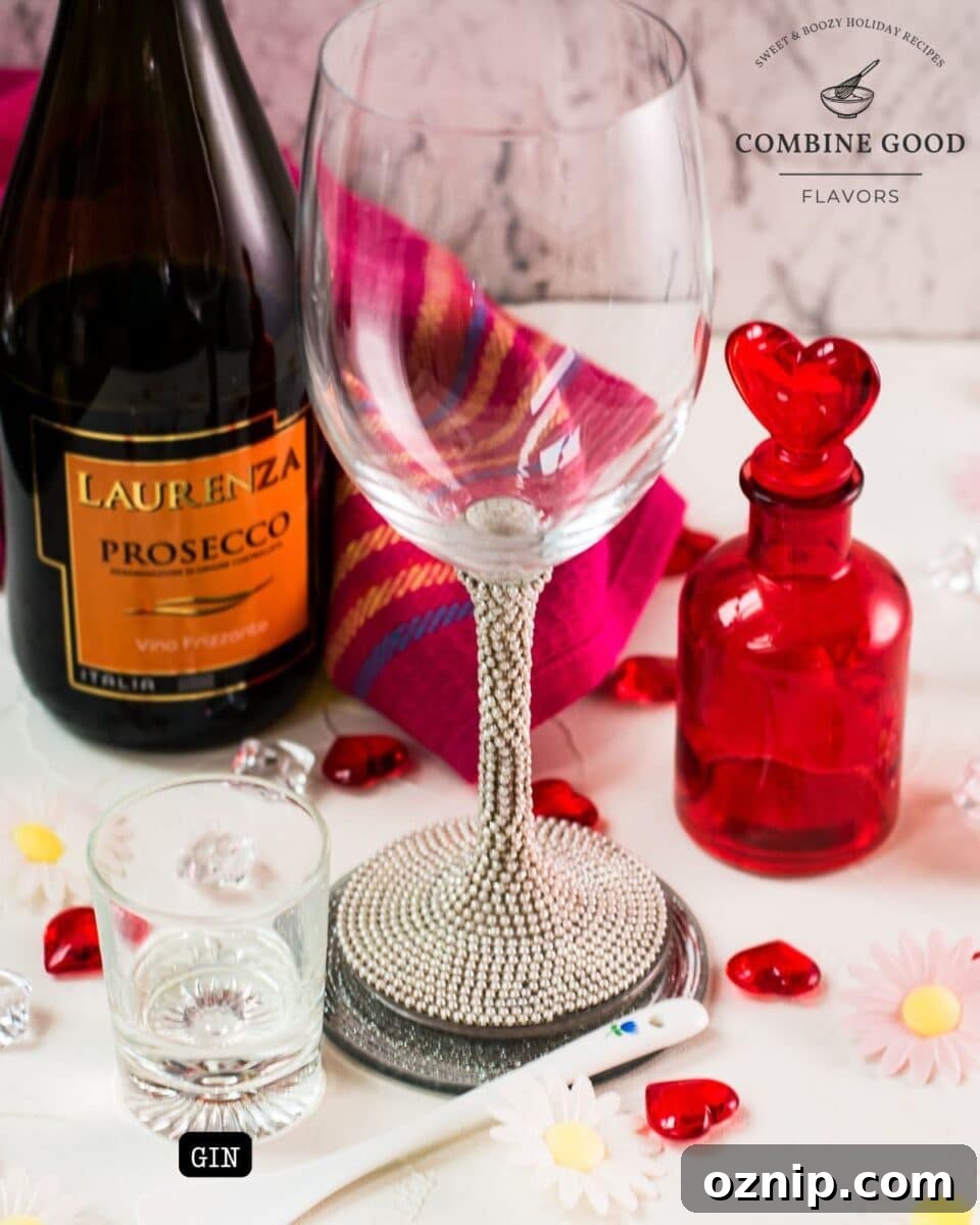 Valentine's Gin Cocktail Recipe for a Romantic Evening 3 Ingredients queens peg - gin, prosecco, and cubed ice.