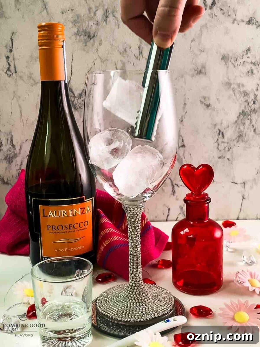 Valentine's Gin Cocktail Recipe for a Romantic Evening 4 Add cubed ice to the wine glass.