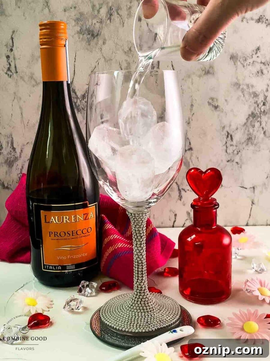 Valentine's Gin Cocktail Recipe for a Romantic Evening 5 Add gin to the wine glass.