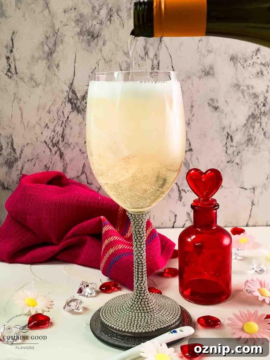 Valentine's Gin Cocktail Recipe for a Romantic Evening 7 Top the gin filled glass with prosecco.