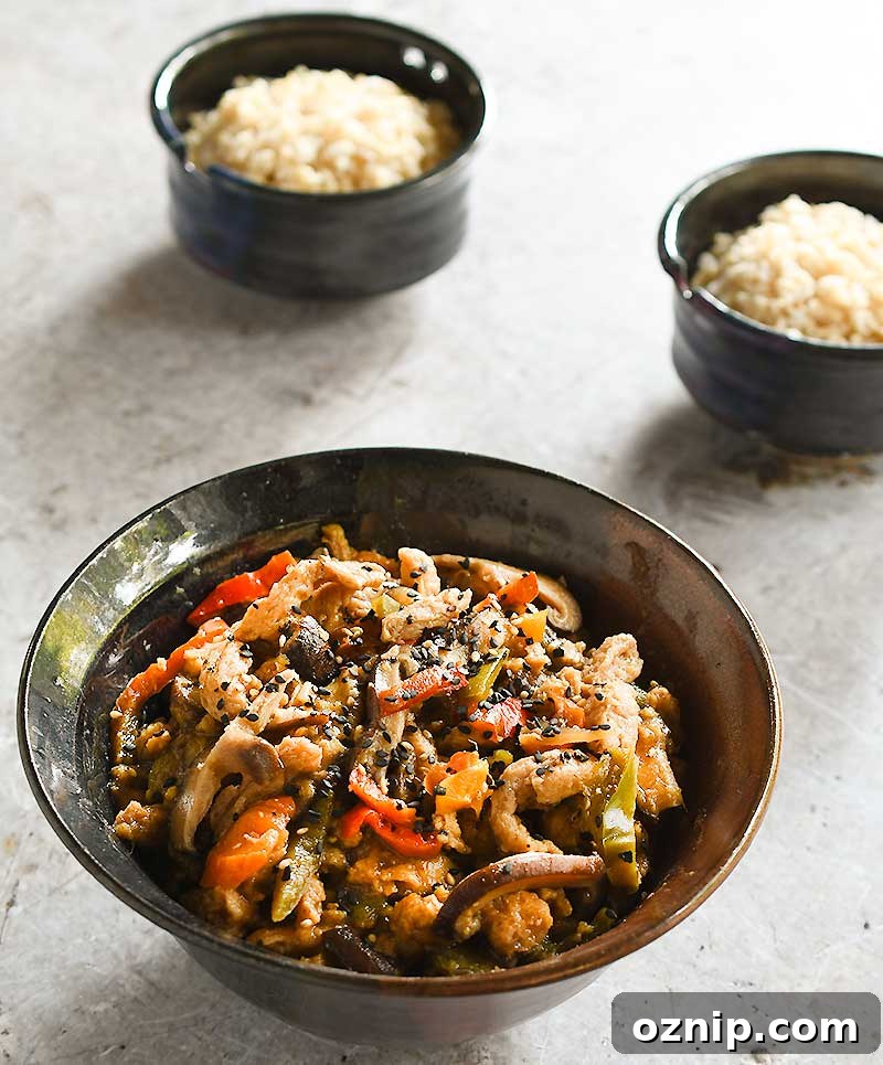 Date Sweetened Teriyaki Soy Curls in a brown ceramic bowl with 2 rice bowls