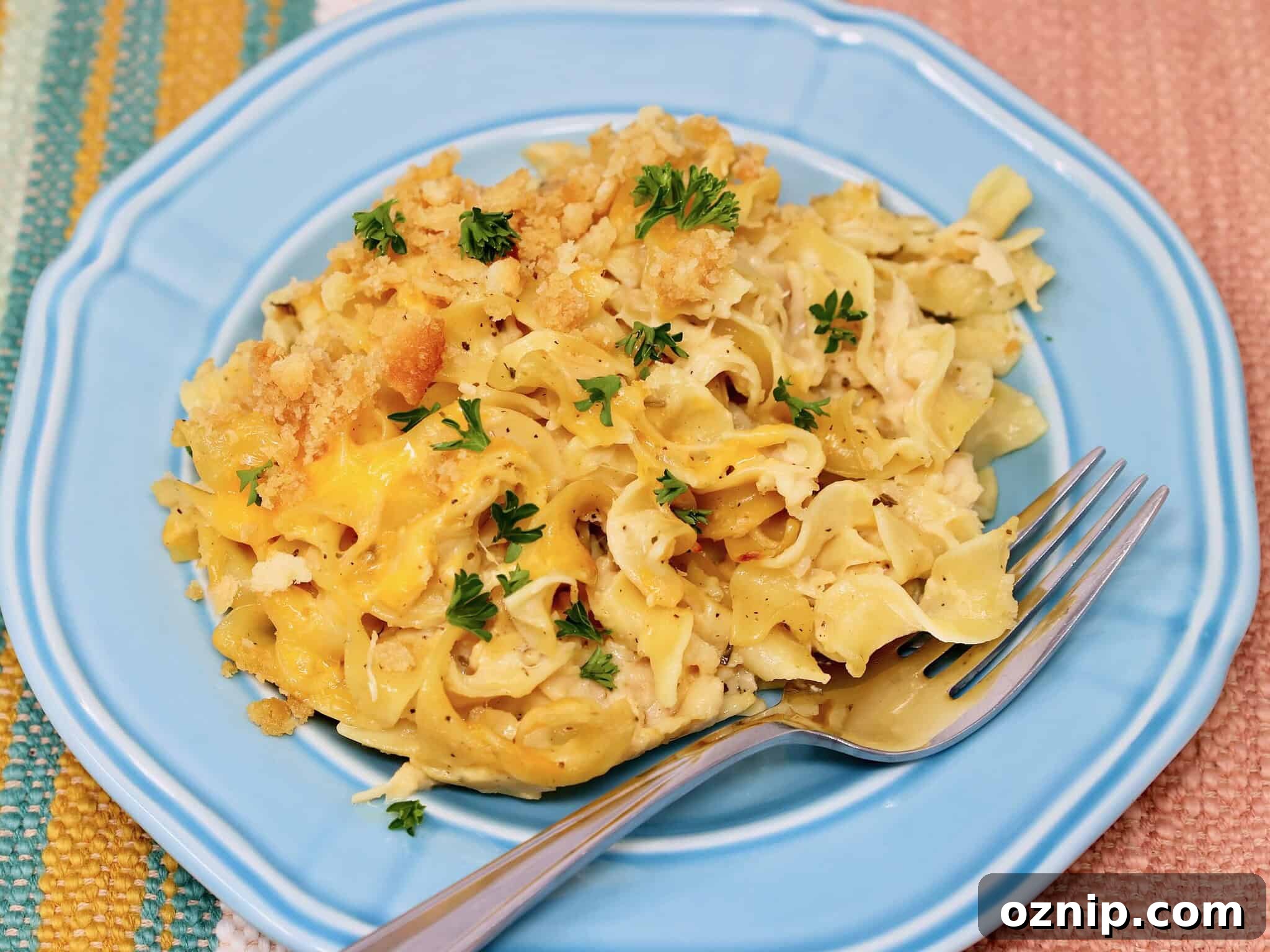 Honey Sesame Popcorn Chicken: Air Fryer or Oven Recipe 8 Scoop of chicken noodle casserole showing creamy sauce and egg noodles