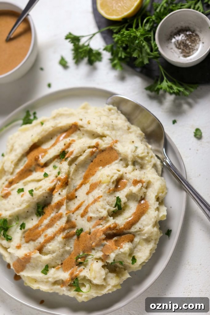 Plant-Based Thanksgiving Sides Your Guests Will Love 5 Cauliflower Mashed Potatoes with Almond Butter Gravy by Flora & Vino