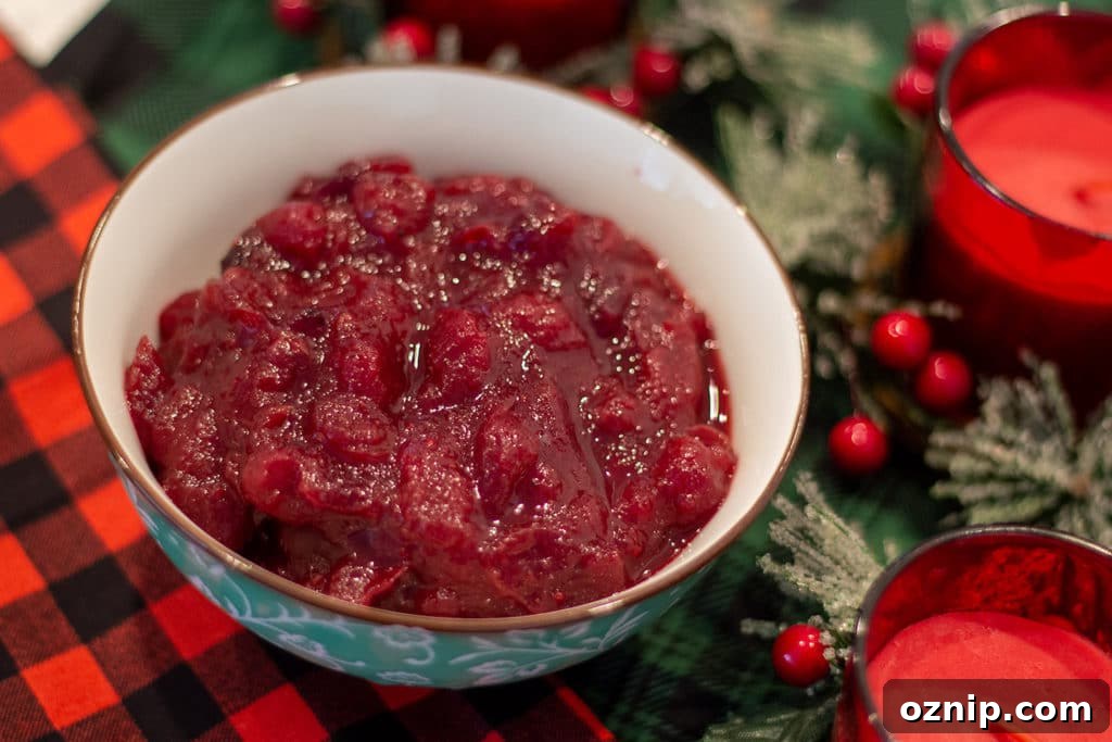 Air Fryer Candied Yams with Marshmallows 10 Cranberry Sauce in a bowl with festive decor