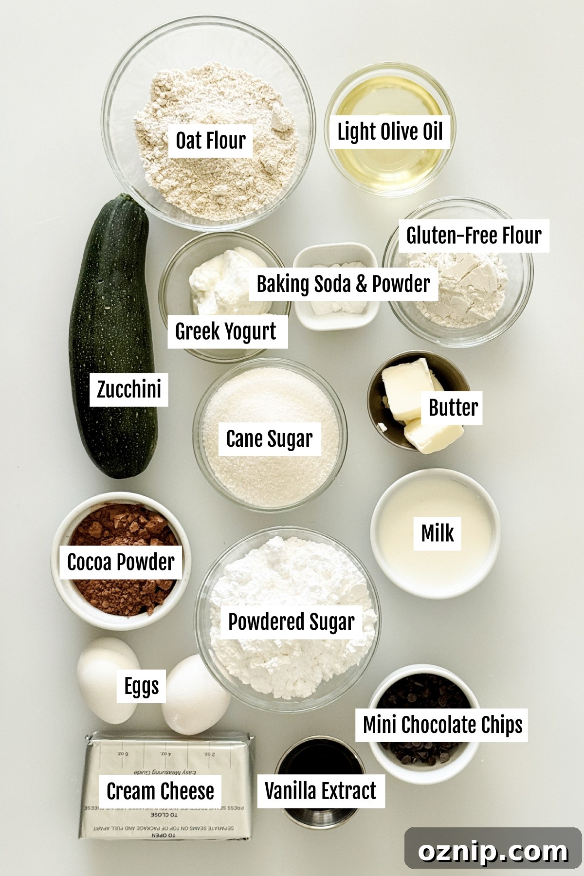 All the ingredients needed to make a gluten-free chocolate zucchini cake with chocolate cream cheese frosting.