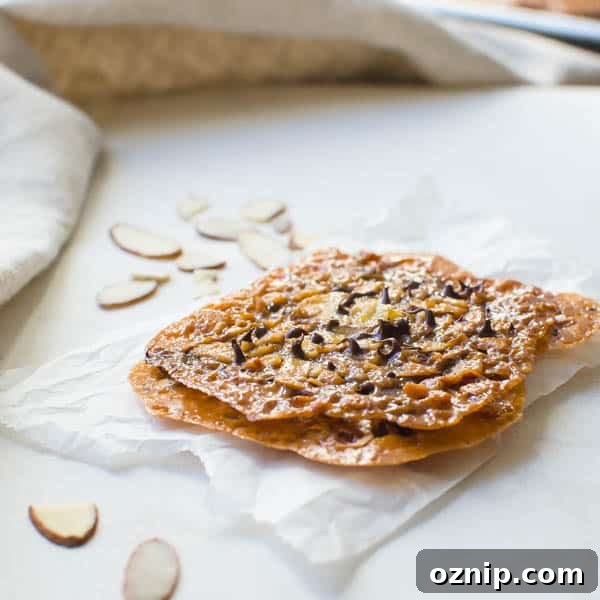 Chocolate Almond Florentines on parchment.