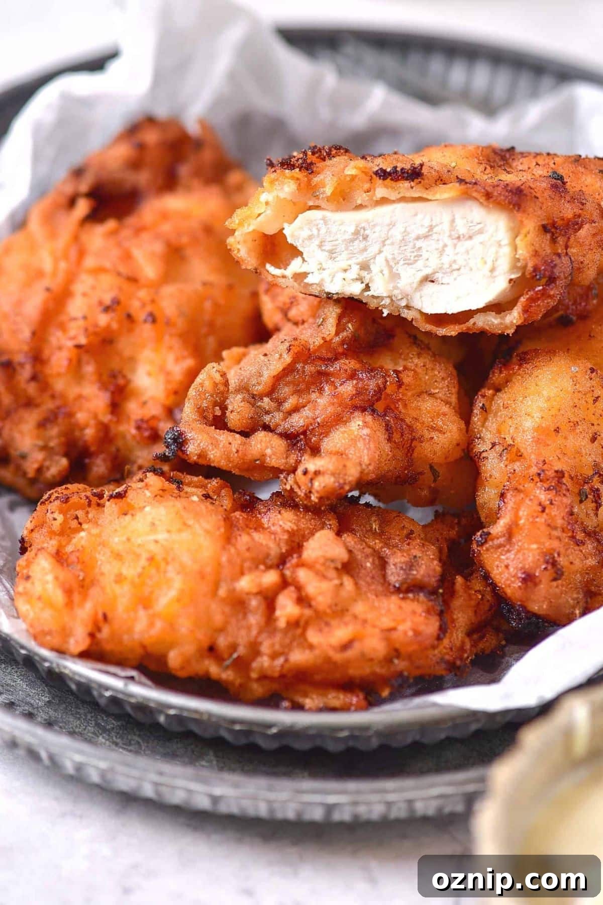 Gluten-Free Dairy-Free Fried Chicken Recipe Up close shot of half-eaten gluten-free dairy-free fried chicken
