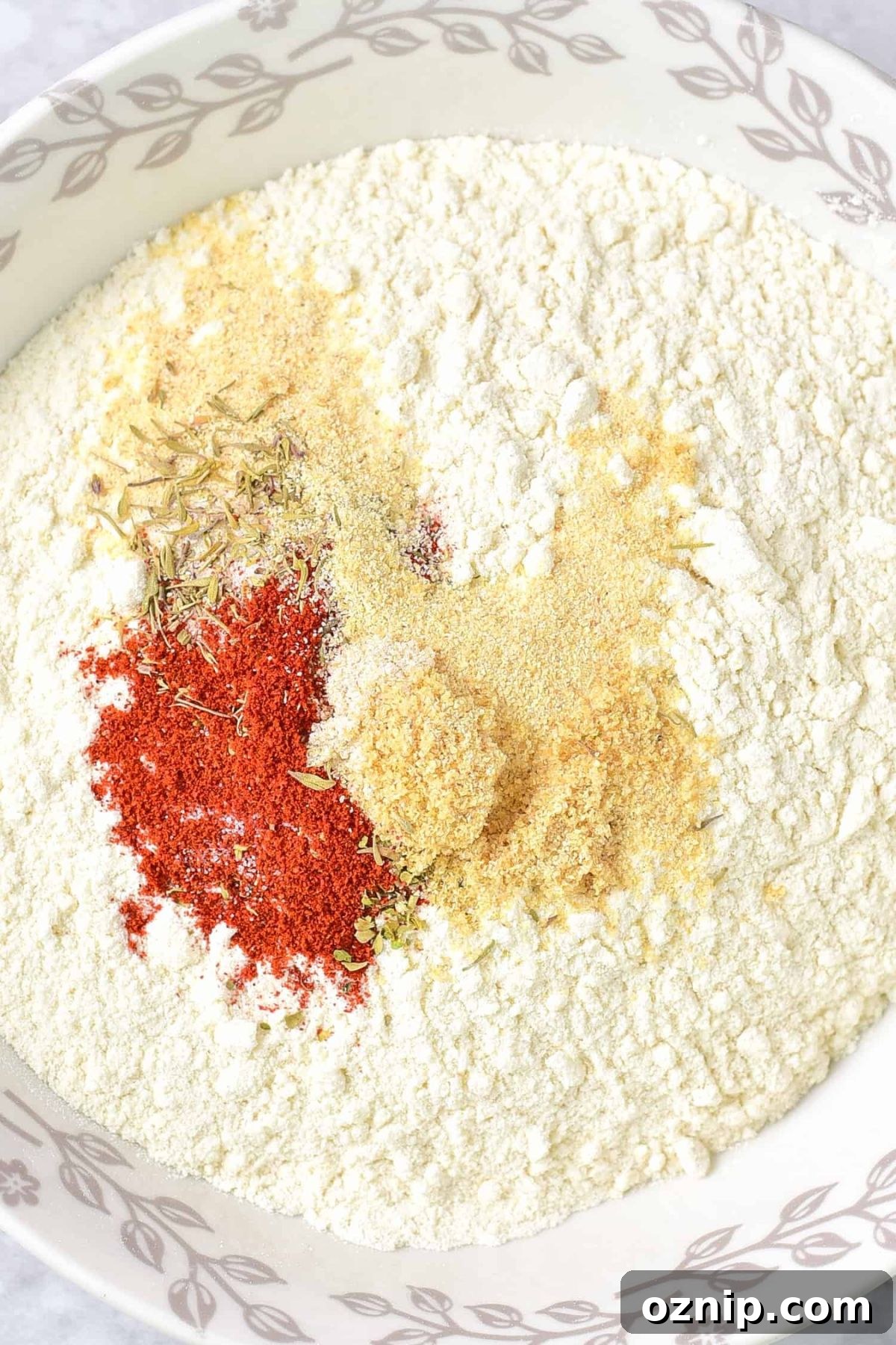 Dairy-Free Fried Chicken (Gluten-Free) Condiments and flour mixture in a bowl.