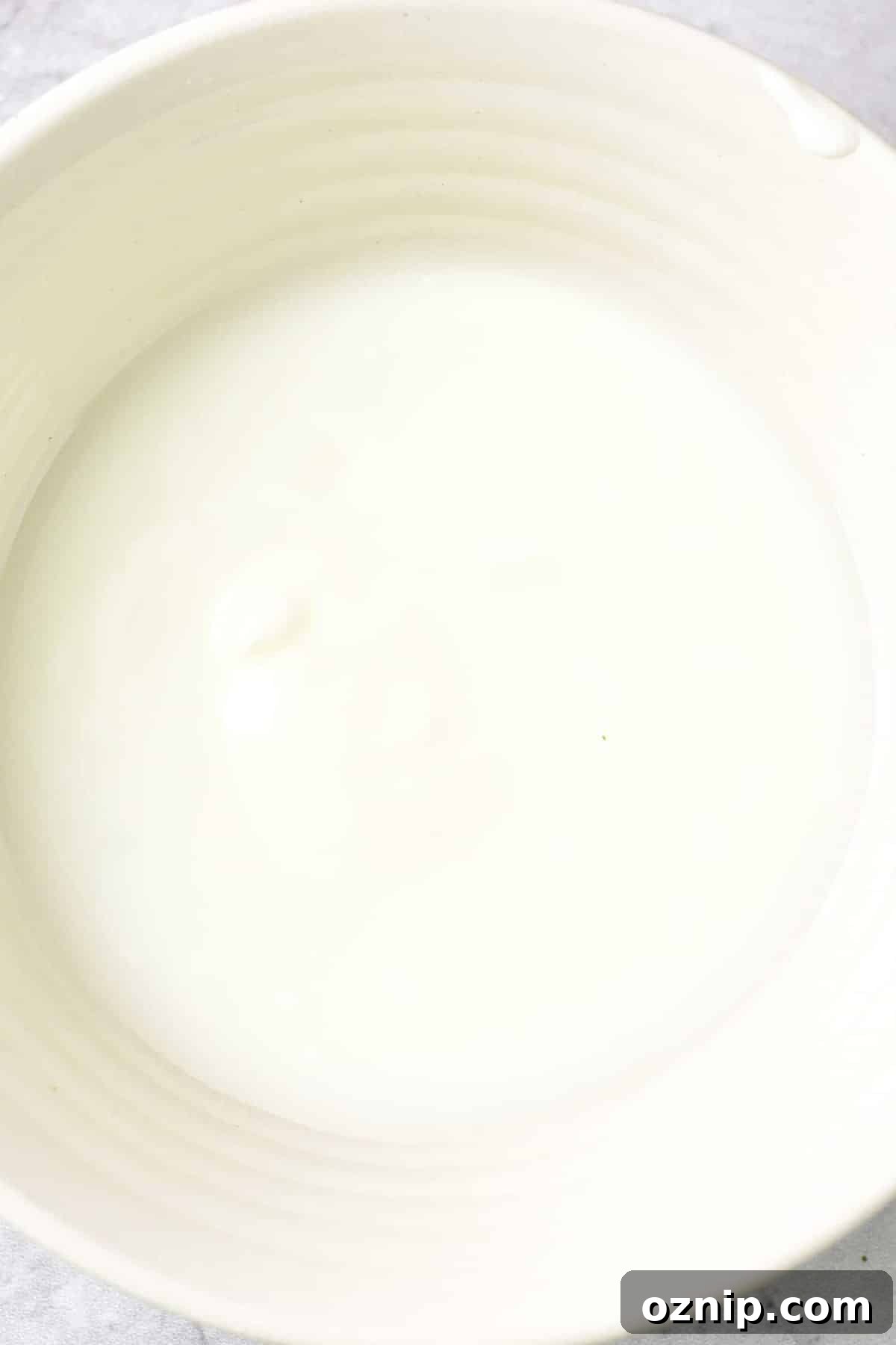 Gluten free fried chicken breast recipe Dairy-free buttermilk in bowl.