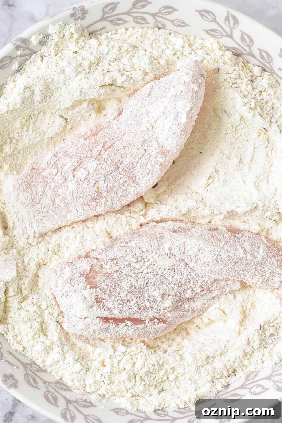 How to Make Gluten-Free Fried Chicken (Dairy-Free) Coating chicken in flour mixture.