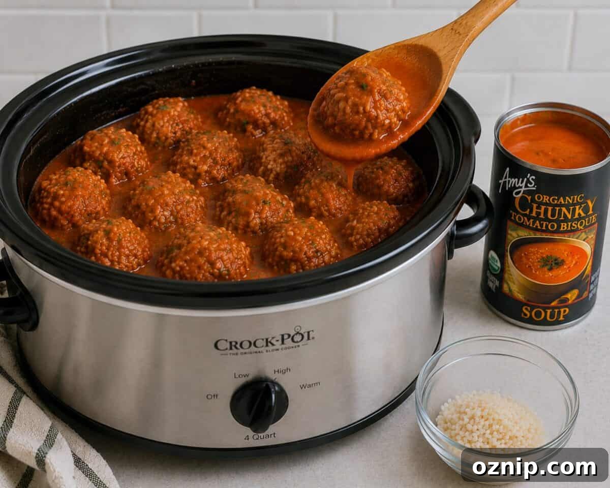 Cooking slow cooker porcupine meatballs in a crock pot with a can of Amy's Organic Chunky Tomato Bisque alongside.