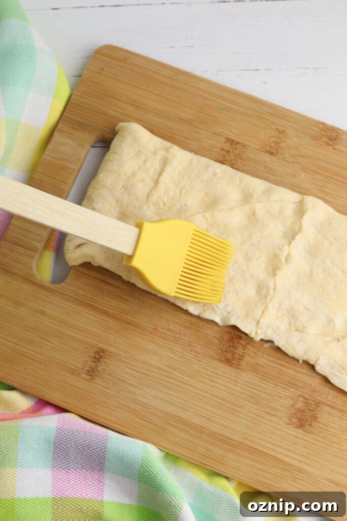 Brushing dough with butter