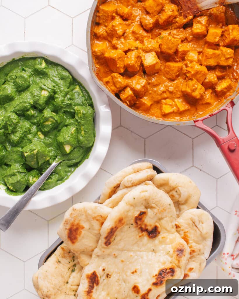 Butter paneer with palak paneer and naan.