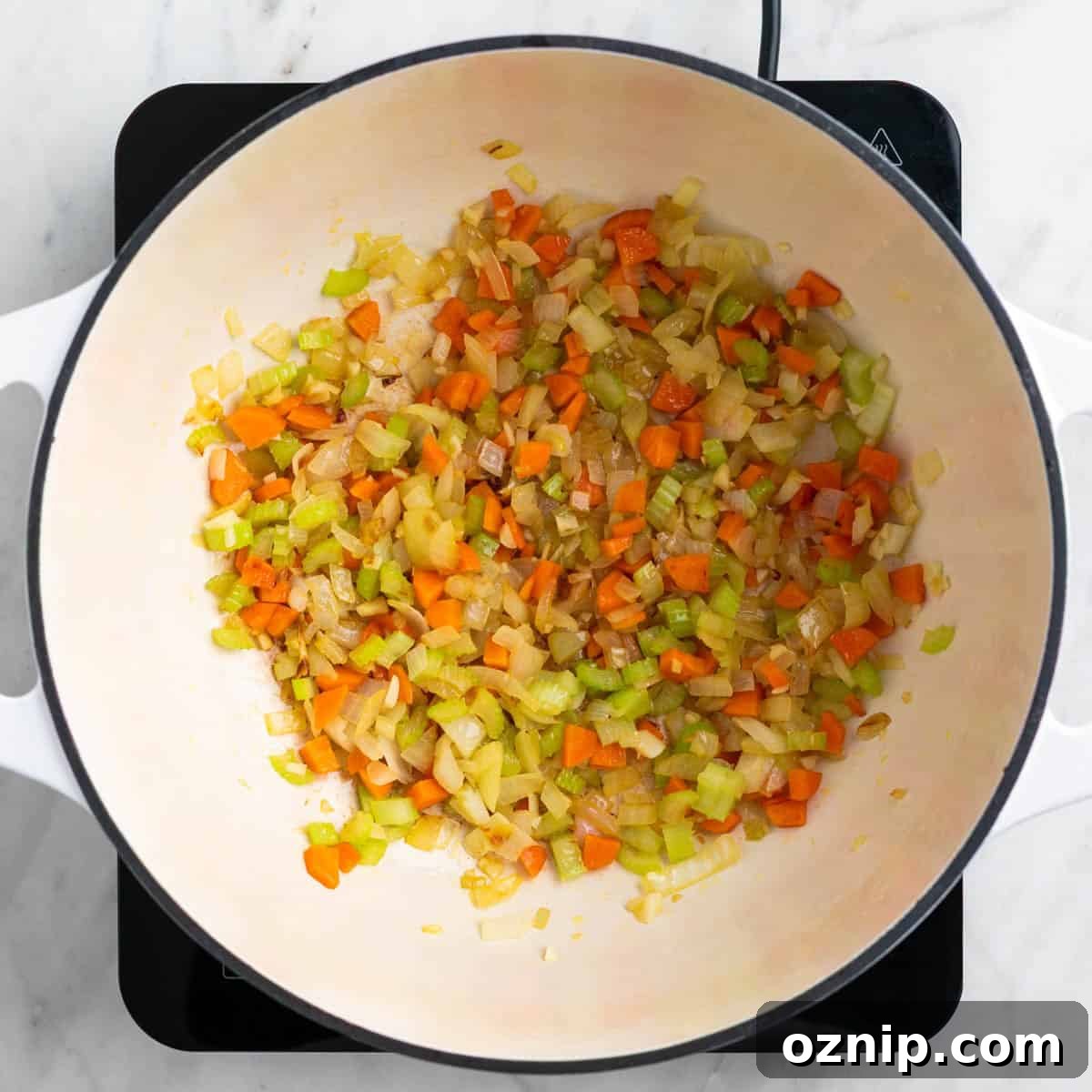 Hearty Vegan Split Pea Soup Recipe 4 Sautéed vegetables cooking in a pot.