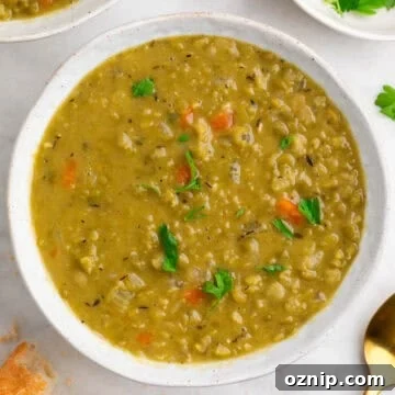 Vegan split pea soup served in a bowl with parsley.