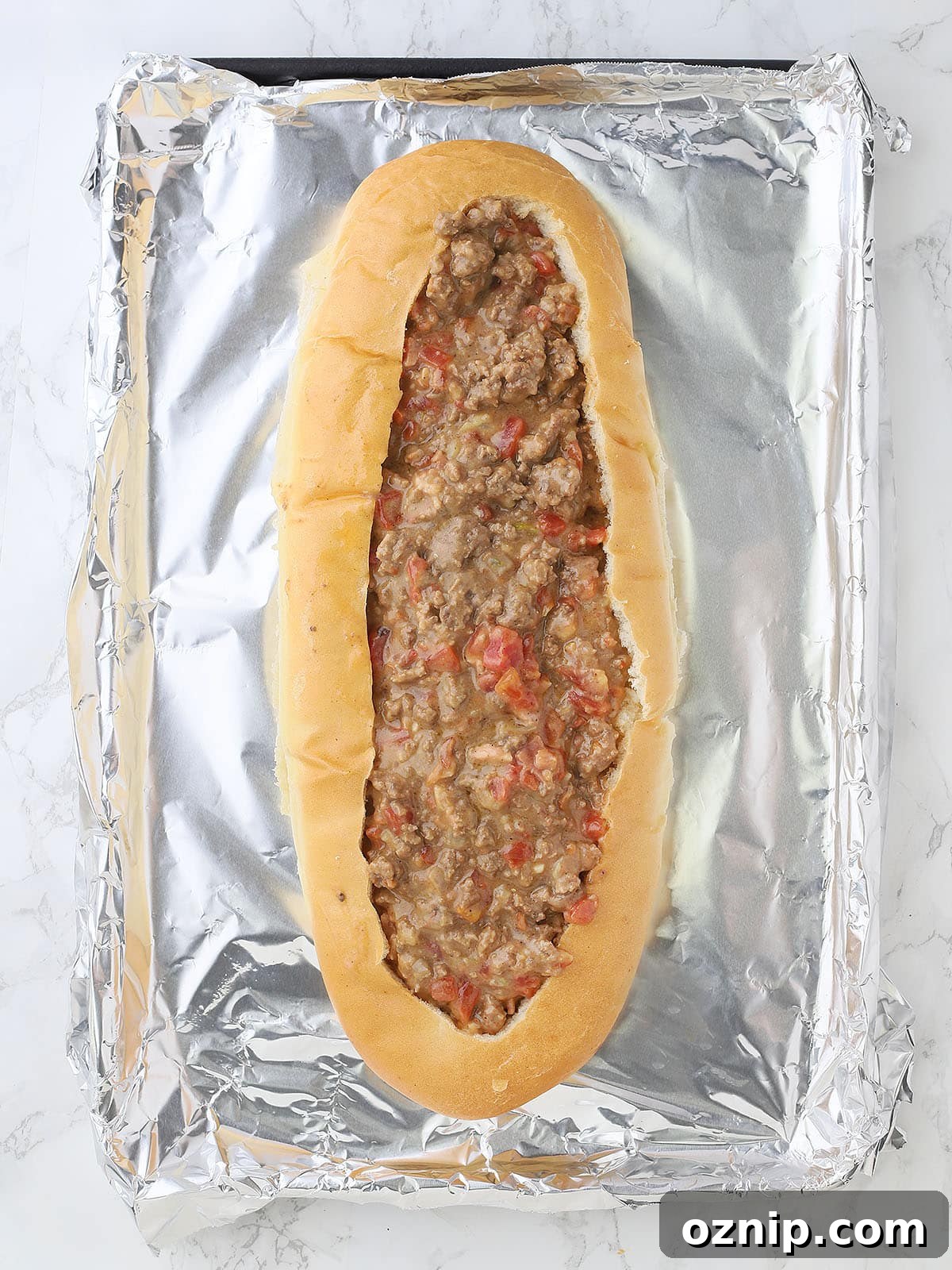 Bacon Cheeseburger Stuffed French Bread Recipe 11 hollowed out French bread loaf filled with the cheeseburger mixture