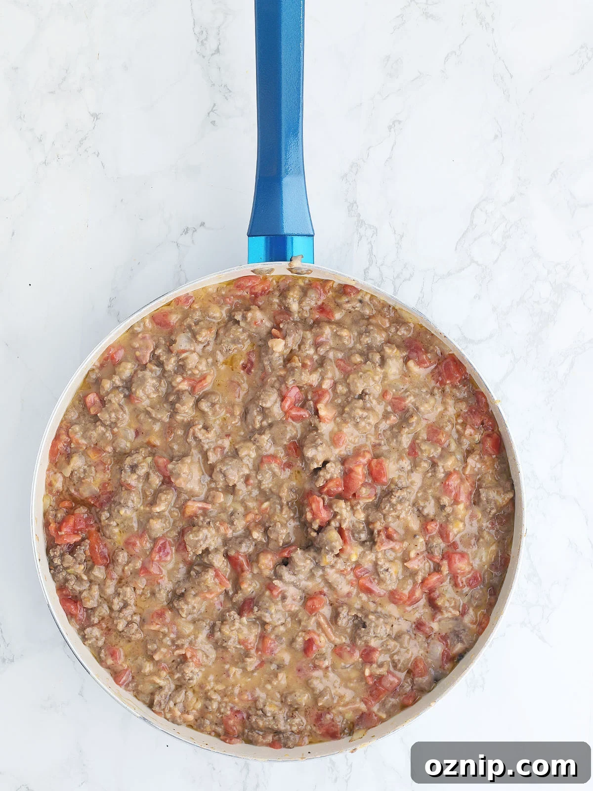 Bacon Cheeseburger Stuffed French Bread Recipe 9 cheeseburger filling in a blue skillet