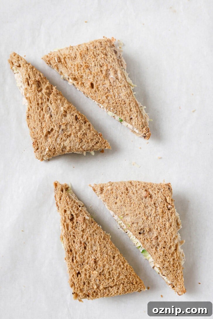 Chicken Sandwiches cut into triangles with crust removed.