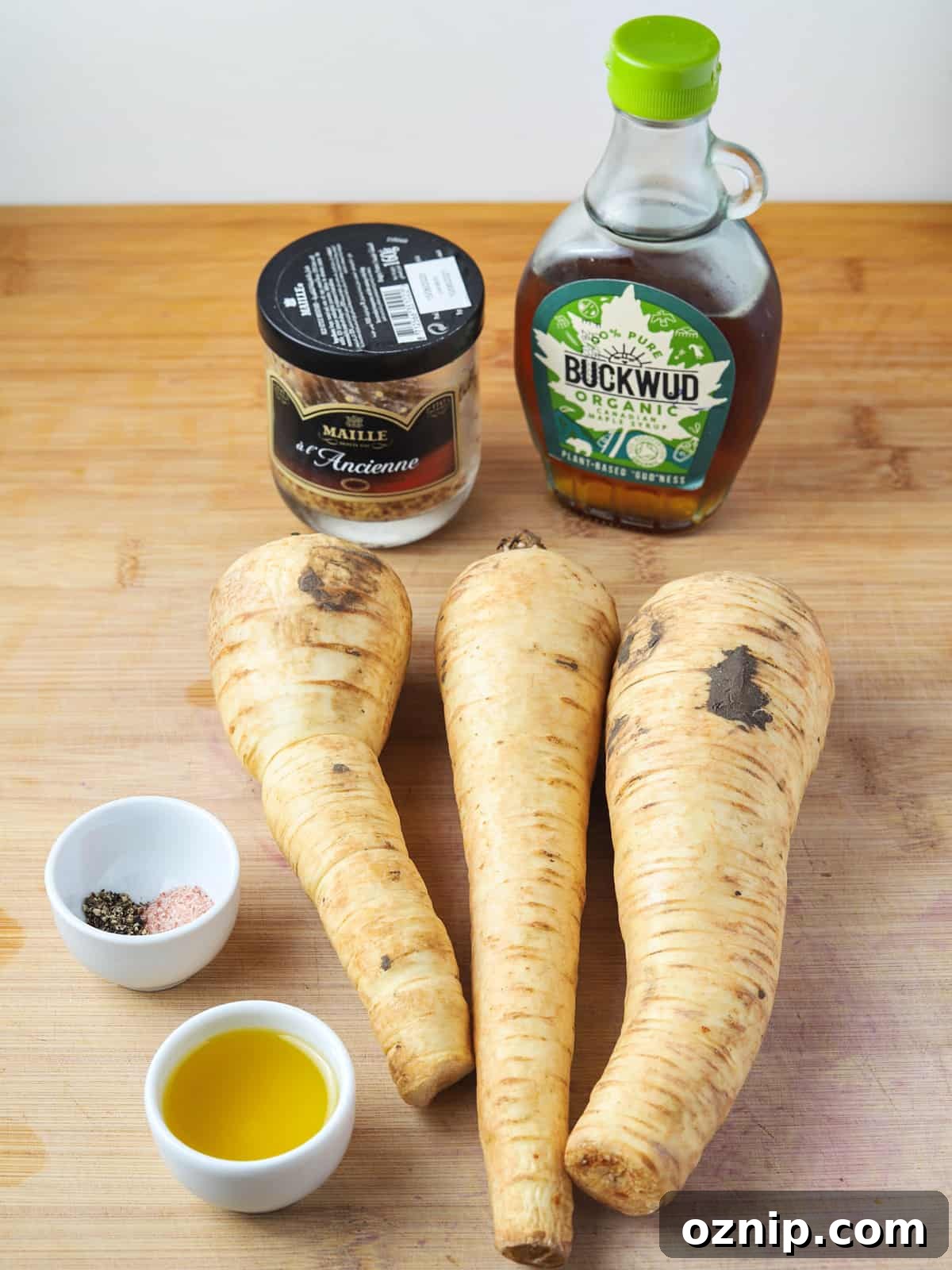 Photo showing the ingredients for making roast parsnips with maple syrup and wholegrain mustard.
