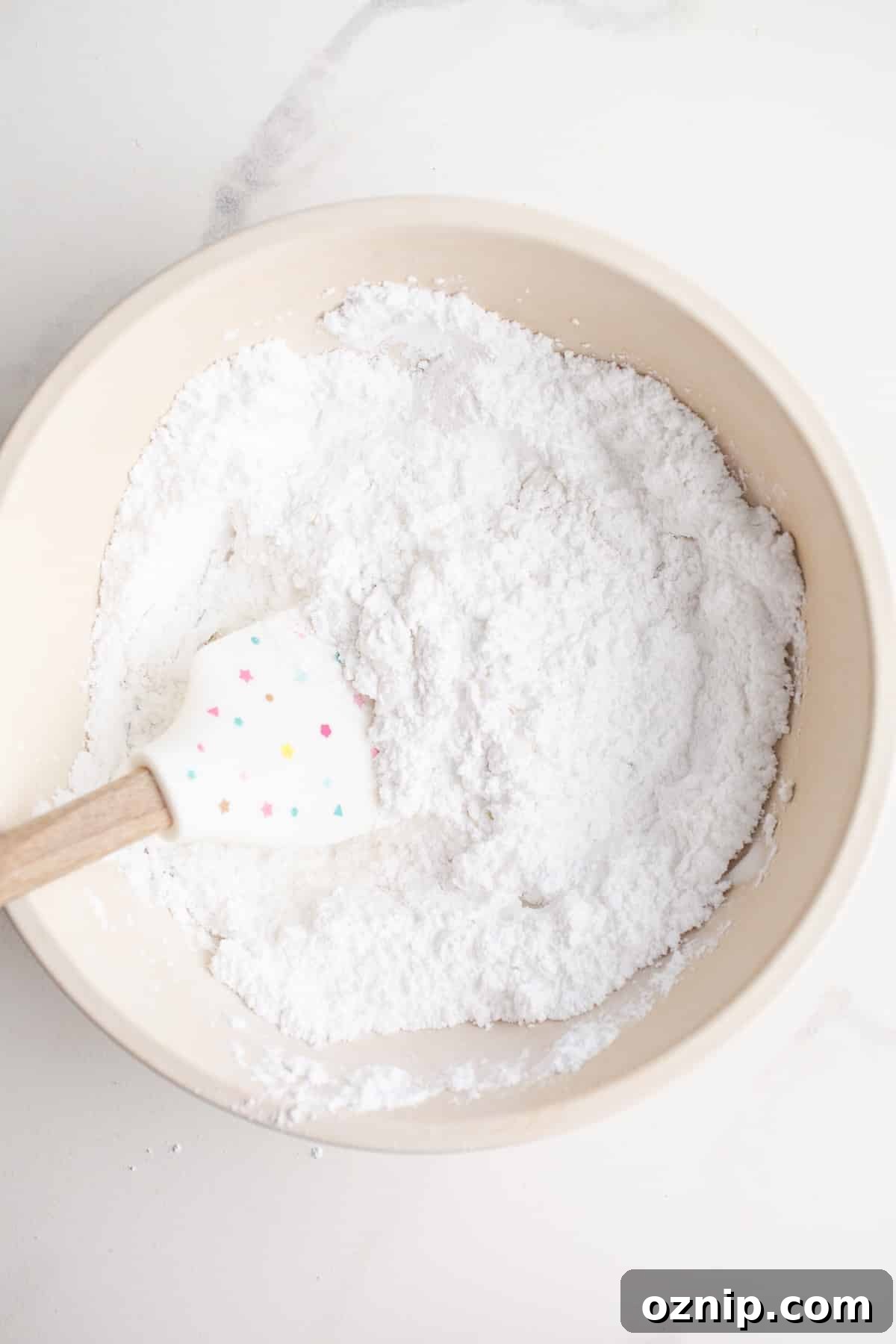 Powdered sugar in a mixing bowl.