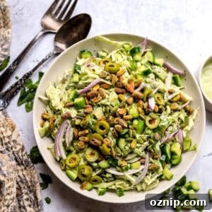 Green Goddess Salad Recipe with Creamy Avocado Herb Dressing 5 Green Goddess Salad recipe in a larger serving bowl with dressing to the side.
