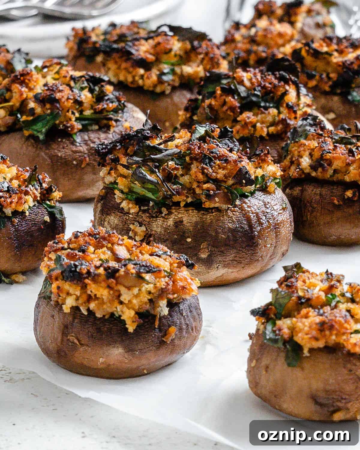 completed Easy Vegan Stuffed Mushrooms on a white surface