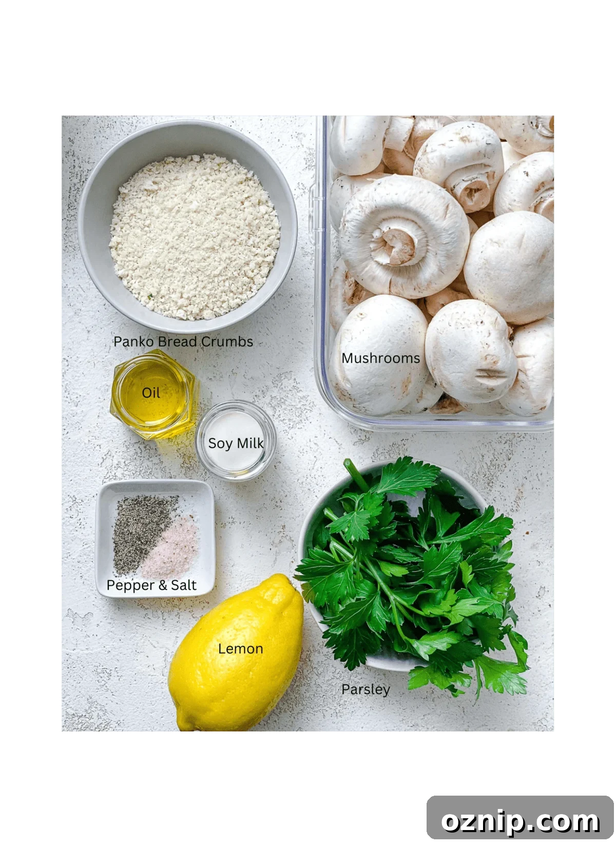 ingredients for Easy Vegan Stuffed Mushrooms measured out against a white surface