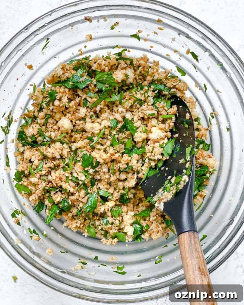 process shot of mixing ingredients together in a bowl