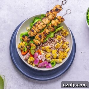 Greek Chicken Kebab Bowl with Tzatziki and Lemon Rice 12 a bowl of Greek chicken skewers