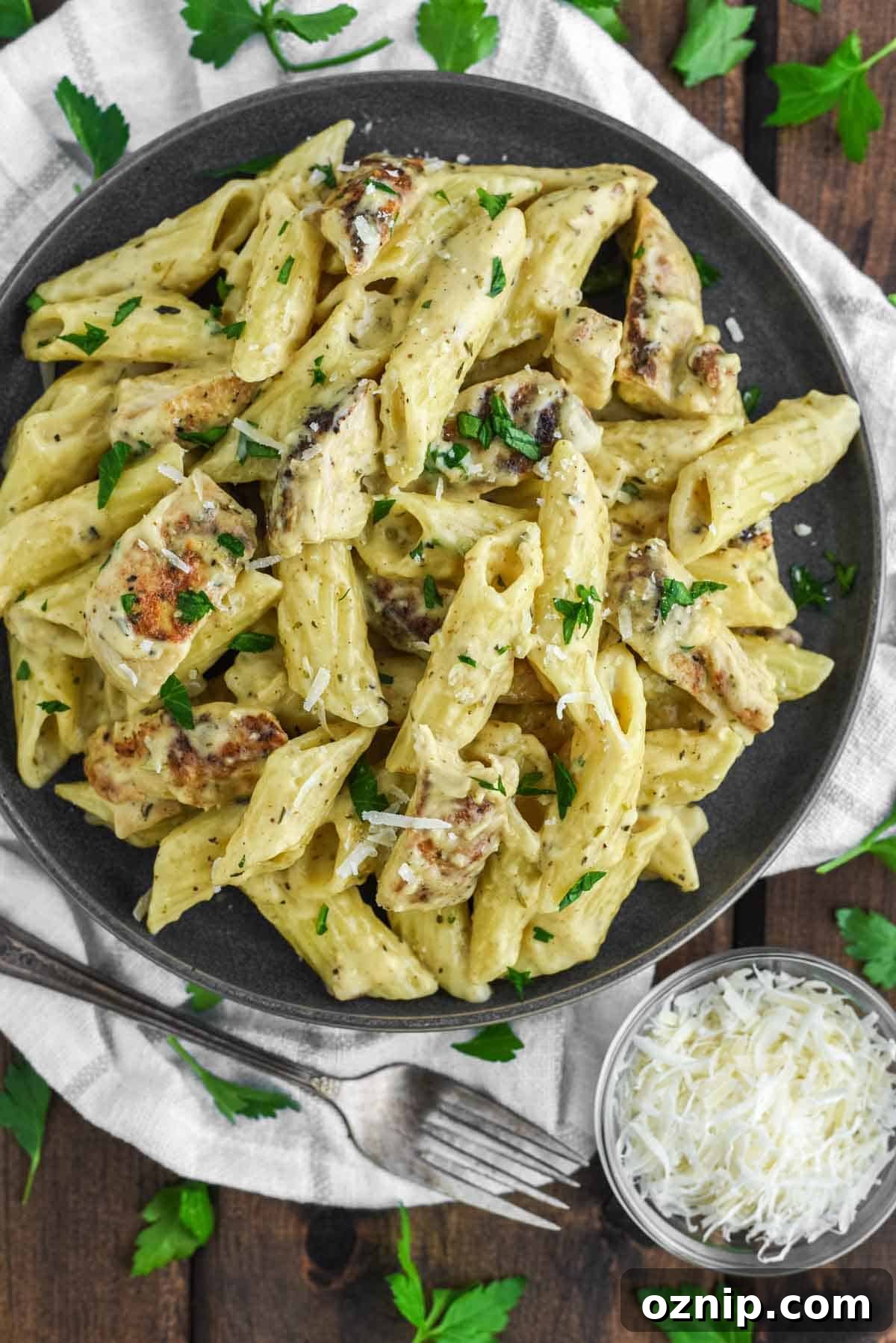 overhead shot of garlic chicken parmesan pasta in plate