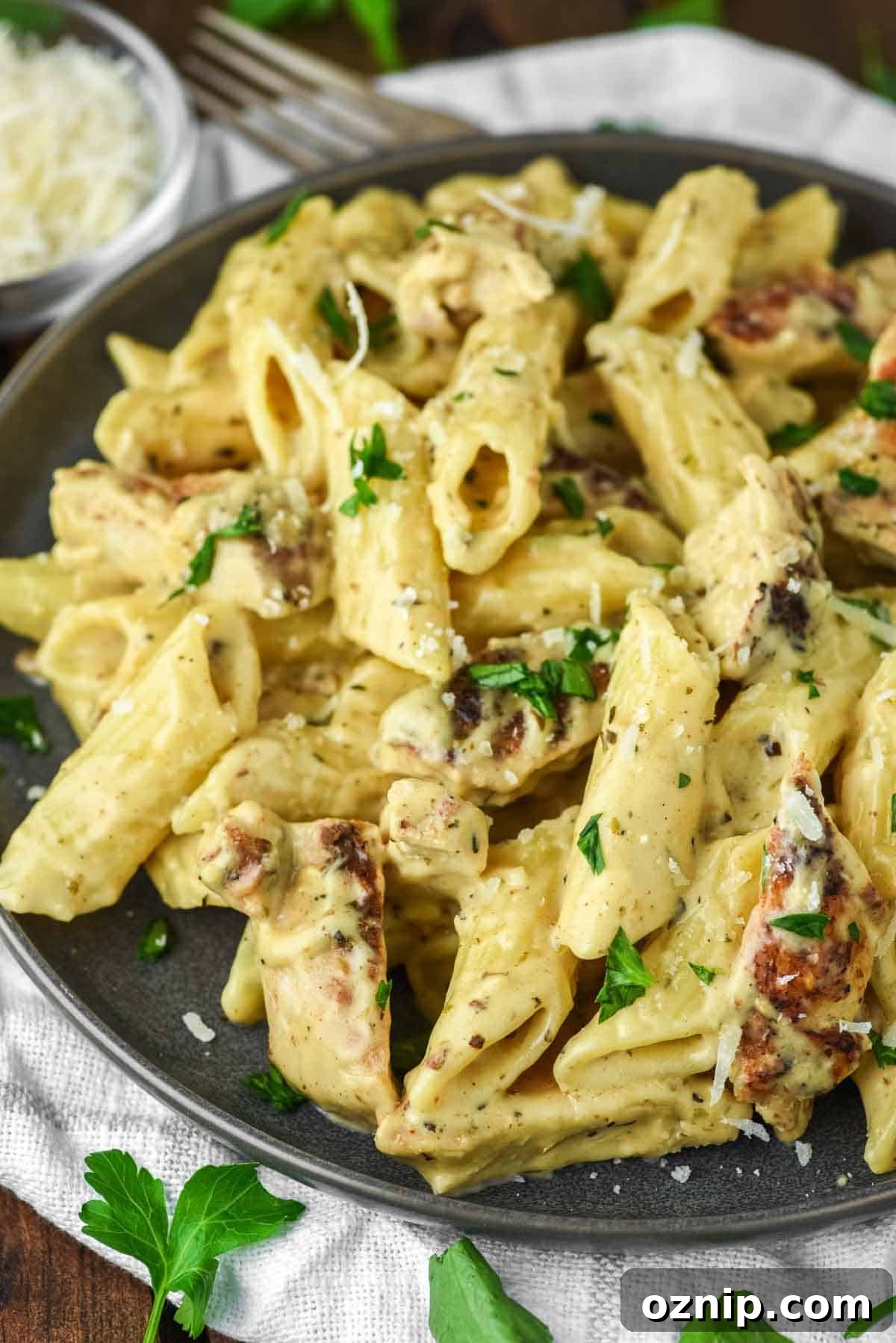 close-up of plate of garlic chicken parmesan pasta