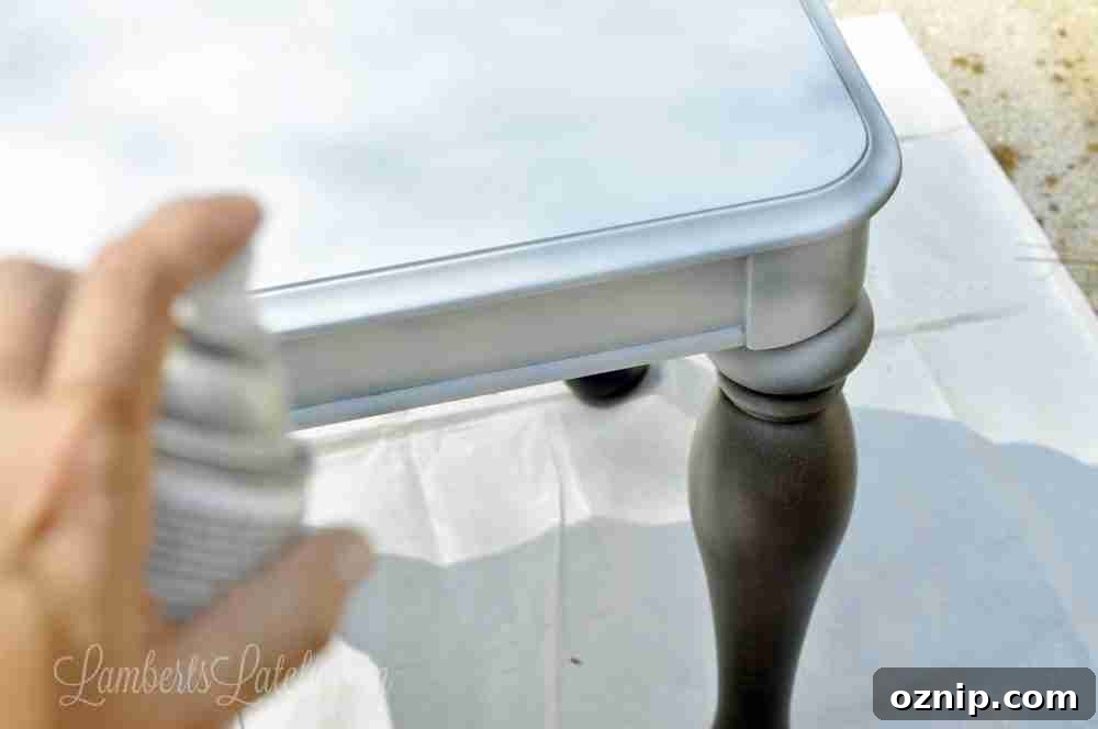 spray painting primer on an end table.