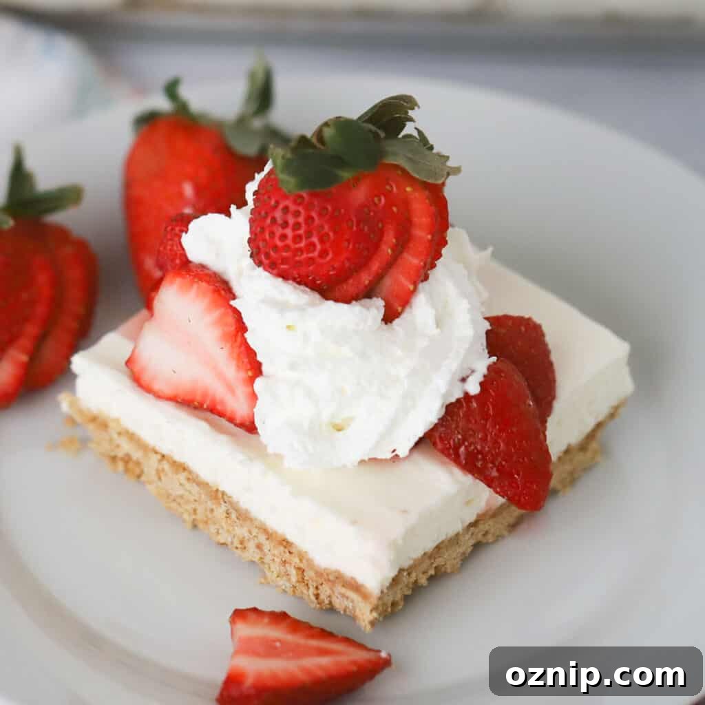 no bake cheesecake bars served with strawberries and whipped cream topping, memorial day menu