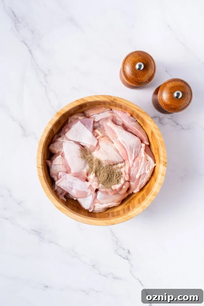 Chicken being coated and fried.