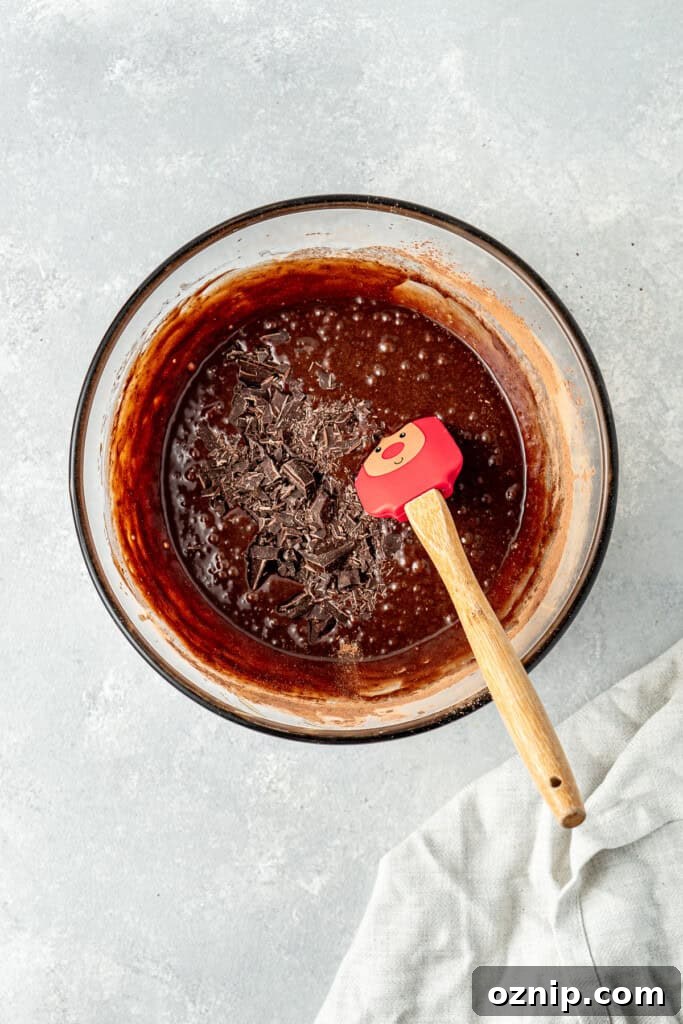 Adding the chopped dark chocolate into the batter.