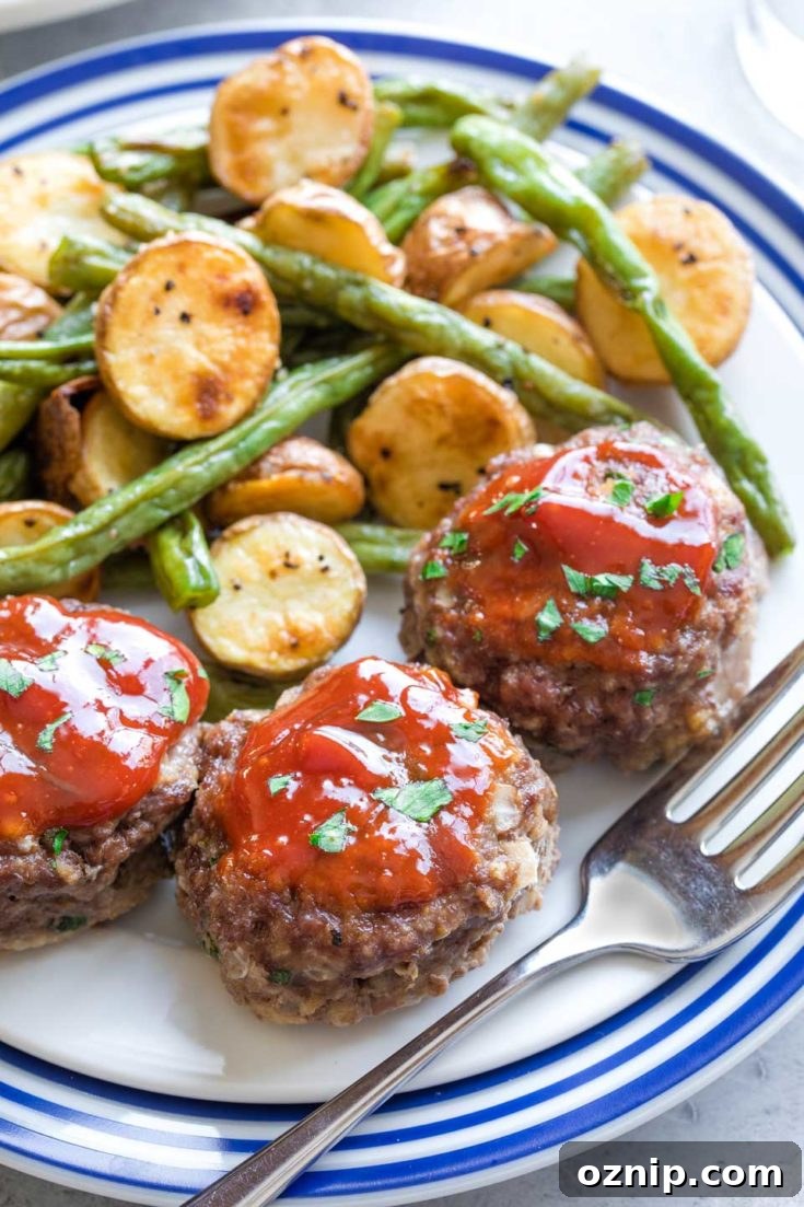 Top 10 Recipes of 2021: Most Popular Dishes Revealed 15 Serving suggestion of meatloaf muffins with roasted potatoes and beans.