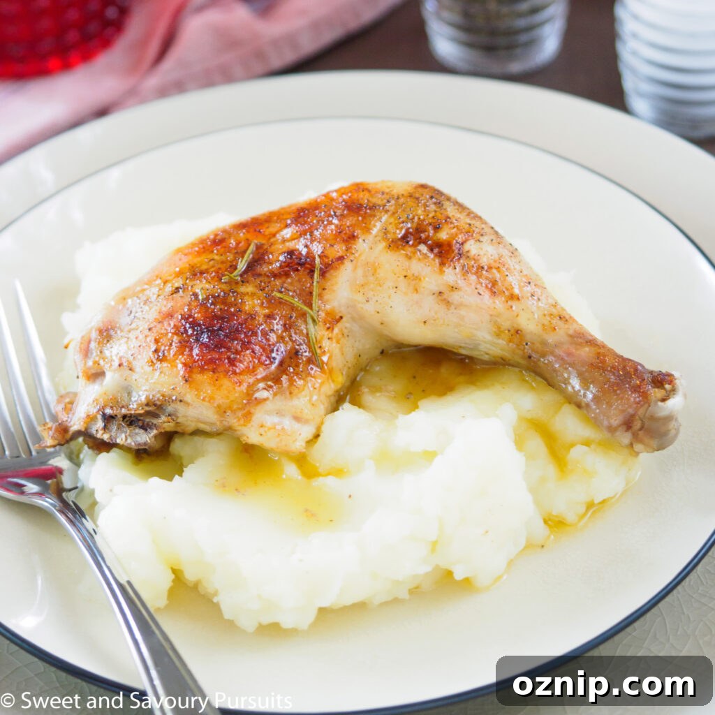 Juicy One Pan Roast Chicken with Garlic and Herbs 4 Roasted chicken thigh over mashed potatoes.