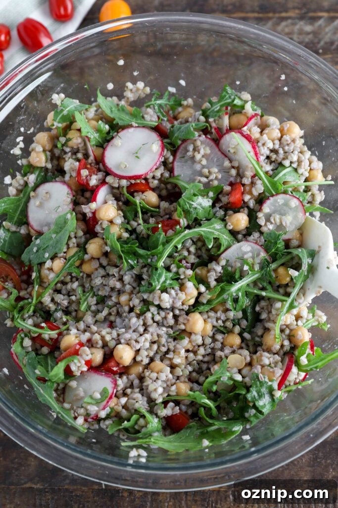 Spring Buckwheat Tabbouleh in glass bowl with spatula 