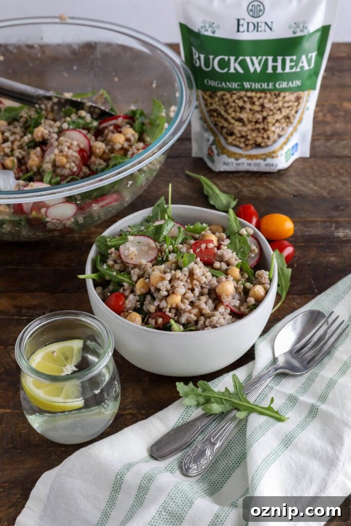 Spring Buckwheat Tabbouleh in bowl with arugula and cherry tomatoes on the side