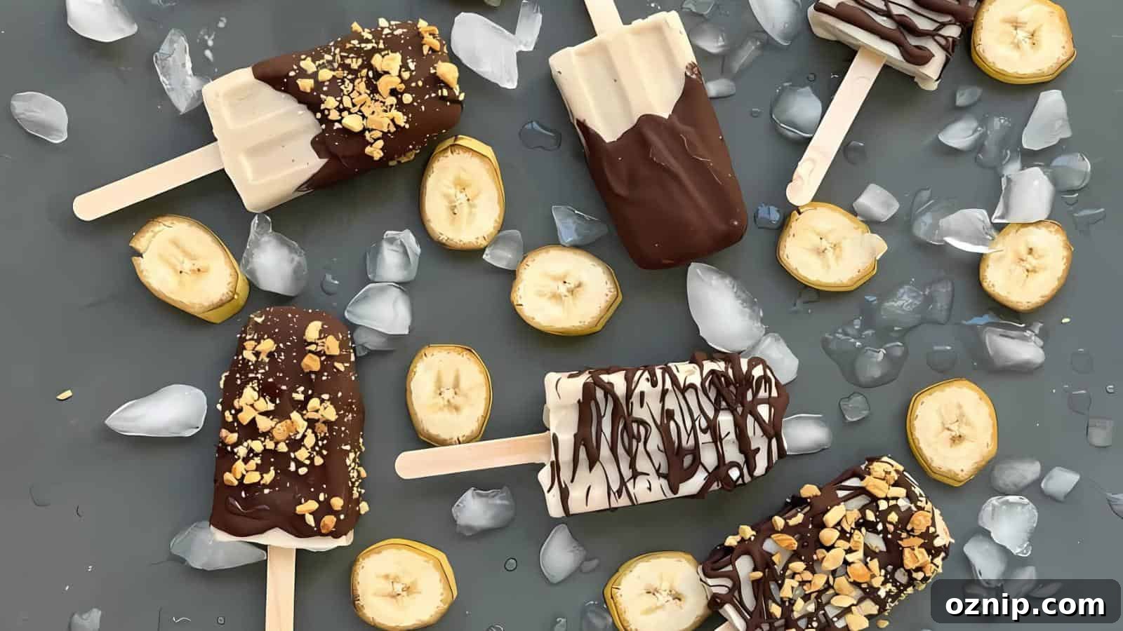 Assorted chocolate-dipped banana popsicles with chopped nuts, sliced bananas, and ice cubes arranged on a dark surface.
