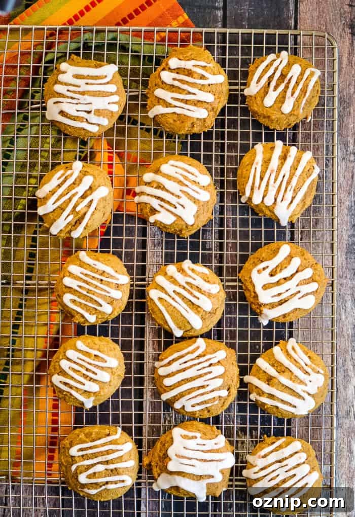 Iced pumpkin cookies cooling on a rack, ready to enjoy. easy pumpkin cookies on a cooling rack